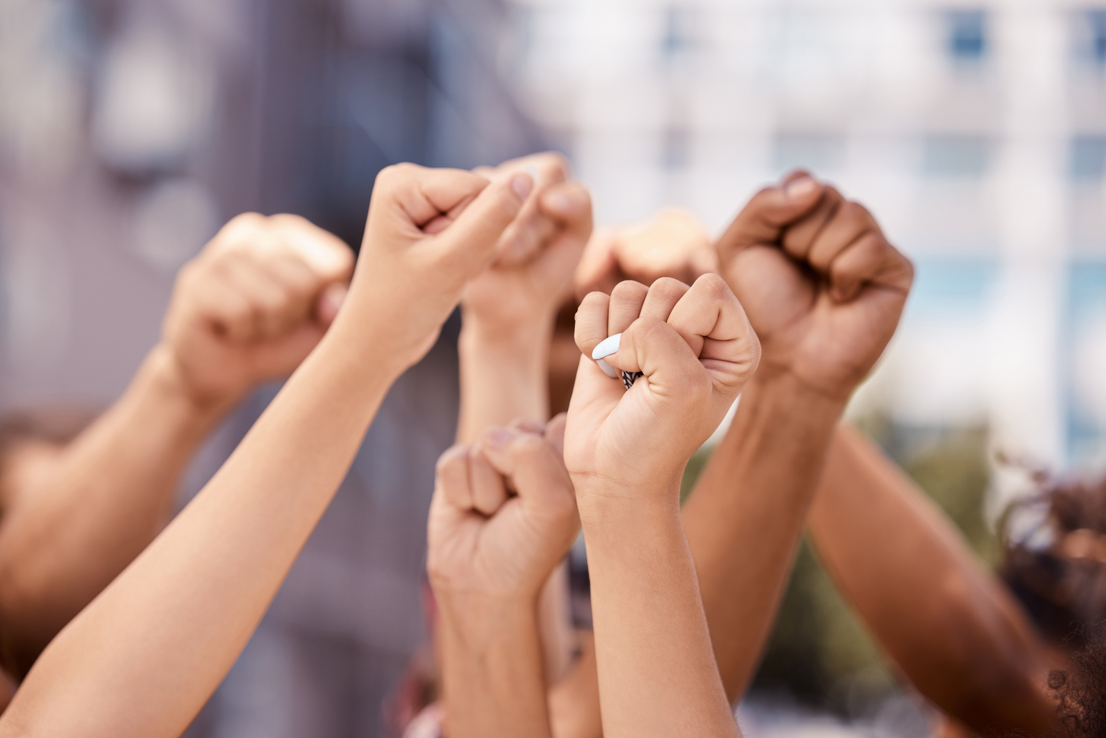 Diversity, Hands and Fist in Community Protest for Human Rights, Racism and Equality in Fight for Justice in the City. Group Hand of People in Strike for Economic or Government Change in a Urban Town